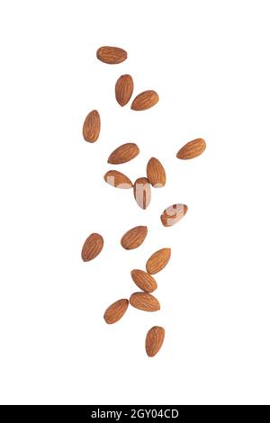 Almonds falling isolated on white background with clipping path. Stock Photo