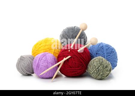 Multi colored balls of yarn with knitting needles, isolated on white background. Stock Photo