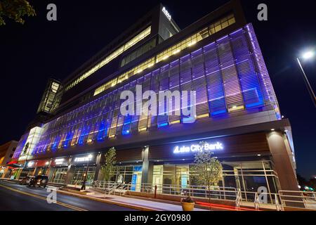 Parking Garage architecture downtown city road with blue and yellow lights Stock Photo