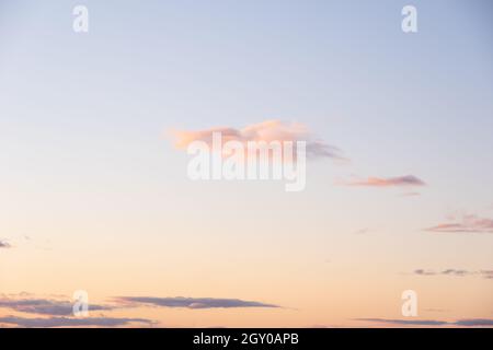 Very beautiful delicate pink orange sunrise or sunset sky and beautiful bright clouds. Beautiful perfect sky for your photos. Heavenly background to o Stock Photo