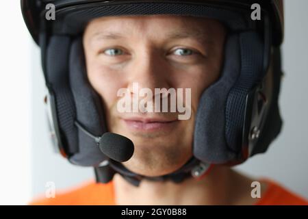 Portrait of man in helmet with microphone for hands free