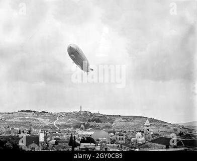 Vintage photo circa April 1931 of the German passenger carrying rigid airship Graf Zeppelin flying over Jerusalem in Israel Stock Photo