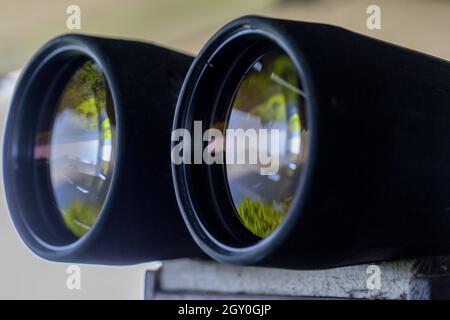 Binoculars detail with sea glass reflection Stock Photo