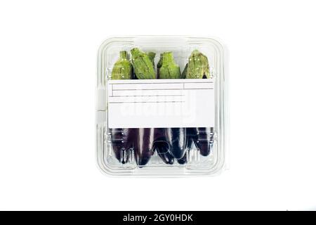 Freshly harvested mini eggplant with package and label on white background Stock Photo