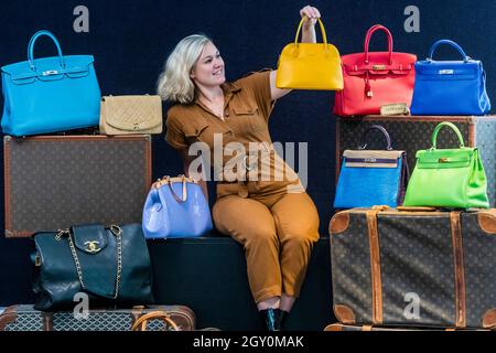 Cologne, Germany. 02nd Sep, 2021. Luxury handbags by Louis Vuitton, Chanel  and Hermes, Birkin Bag (front) and Mini Birkin (r), are on display at  Sotheby's new German branch. The auction house intends