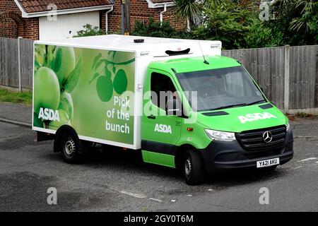 Side & front view Asda supermarket transport van food supply chain retail business online internet grocery shopping after home delivery in UK village Stock Photo