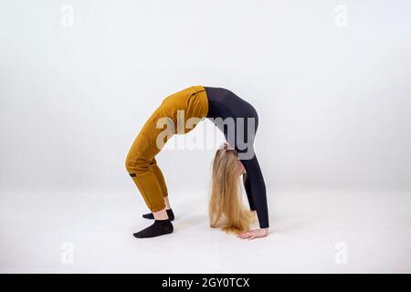 Young blonde blue-eyed dancer woman on white background Stock Photo