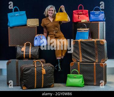 London, UK. 06th Oct, 2021. Led by a 2011 special-order tri-colour Alligator Retourné Kelly 35, estimate £30,000 - 40,000 (an example of Hermès bespoke service - Right middle) and including a beige lambskin medium Chanel ‘Diana' single flap bag, 1991 - 94, estimate £2,000-4,000 (Left top) and a Jaune D'Or Epsom leather mini Bolide 27 Hermès, 1993, est £1,600 - £2,000 and many others - Preview of Bonhams' Designer Handbags and Fashion sale at their Knightsbridge site. The sale takes place on 12th October. Credit: Guy Bell/Alamy Live News Stock Photo