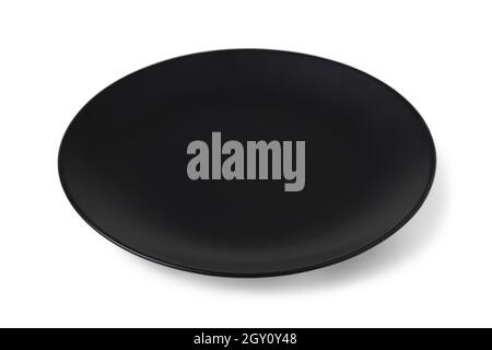 Black ceramic plate isolated on white background Stock Photo