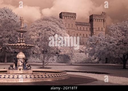 An autumnal view across Vivary Park in Taunton, Somerset, England, UK, showing  Queen Victoria Memorial Fountain and the former Jellalabad Barracks. Stock Photo