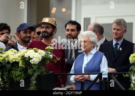 File photo dated 15/5/2014 of Queen Elizabeth II meets HH Sheikh Mohammed Bin Rashid Al Maktoum (left) at the finish of the Royal Windsor Endurance at the Royal Windsor Horse Show at Windsor Castle, London. The ruler of Dubai authorised the hacking of his former wife and her lawyers' phones with multi-million-pound spyware during a legal battle over their two children, the High Court has found. Sheikh Mohammed bin Rashid Al Maktoum, 72, gave his 'express or implied authority' for the phone of his sixth wife Princess Haya Bint Al Hussein, 47, to be infiltrated with Pegasus spyware during the on Stock Photo