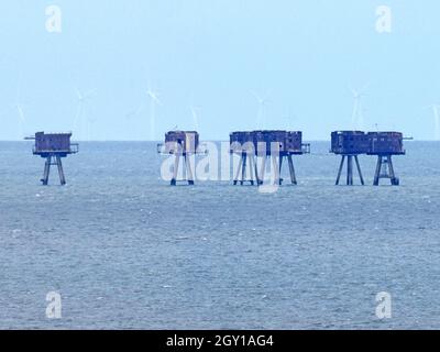 Minster on Sea, Kent, UK. 6th October, 2021. Experts from Berkshire based 'Structural Repairs' have claimed the iconic Red Sands Thames Estuary WWII forts could be gone within a decade without significant maintenance. The towers pictured from  Minster on sea, Kent this afternoon. Credit: James Bell/Alamy Live News Stock Photo