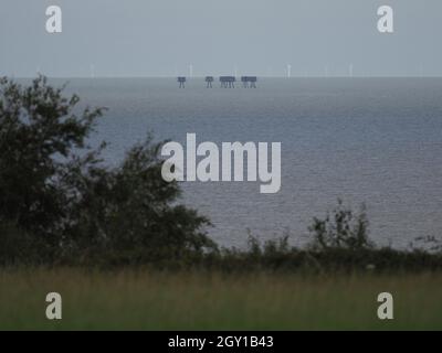 Minster on Sea, Kent, UK. 6th October, 2021. Experts from Berkshire based 'Structural Repairs' have claimed the iconic Red Sands Thames Estuary WWII forts could be gone within a decade without significant maintenance. The towers pictured from  Minster on sea, Kent this afternoon. Credit: James Bell/Alamy Live News Stock Photo