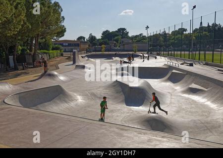 Uzes, France. 17th Jul, 2021. Scooters and skateboards in the Uzes Skatepark. Stock Photo