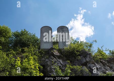 Ten Commandments on stone tablets inside of former limestone quarry and current nature reserve Kadzielnia in the city of Kielce in Poland Stock Photo