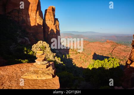 Deep shadows fall across orange rocks at Bell Rock Stock Photo