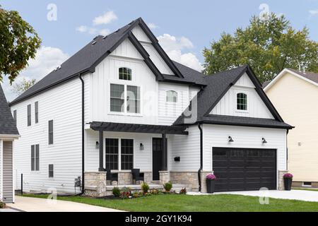 black garage door white house