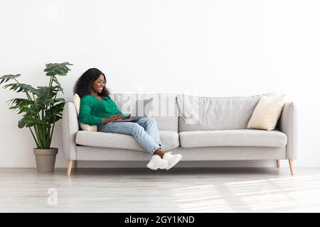 Stylish african american lady independent contractor working from home Stock Photo