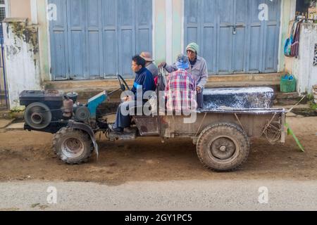 HSIPAW, MYANMAR - DECEMBER 3, 2016: Local people on a tractor in a village near Hsipaw, Myanmar Stock Photo