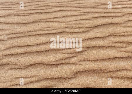 Brown wavy sand texture close up, beautiful natural natural background Stock Photo
