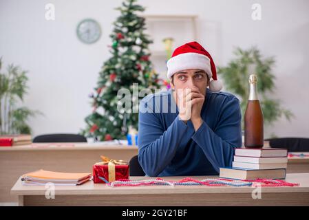 Young student preparing for exams during new year celebration Stock Photo