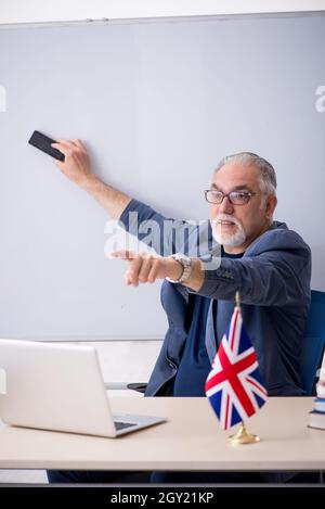 Old english language teacher in the classroom Stock Photo