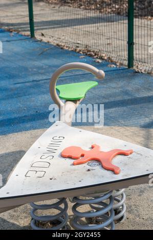 POZNAN, POLAND - Mar 25, 2018: A closeup shot of a 3d swing equipment on a playground on the park Cytadela Stock Photo