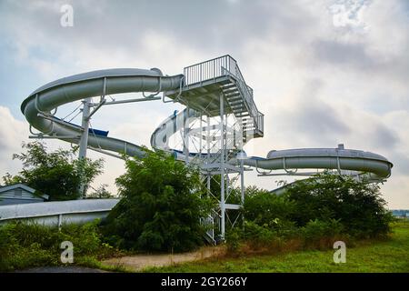 Ominous shot of a snaking water slide against an overcast day Stock Photo