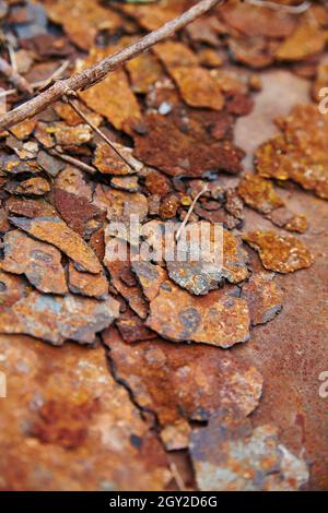 Fragments of rusted peeling metal textured background Stock Photo
