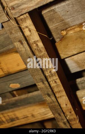 Close up of brown fraying wooden boards held together with nails Stock Photo