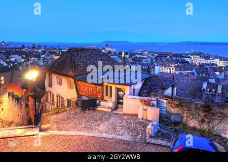 Night view of Neuchâtel town and lake from the Castle terrace. Stock Photo