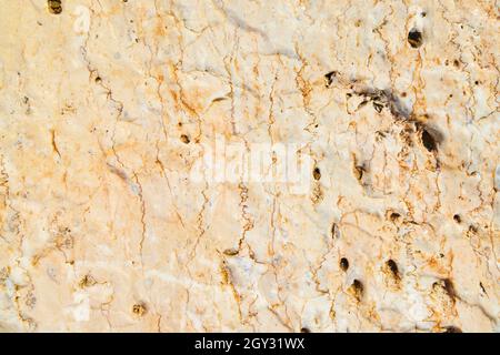 Texture of rock up close yellow with veins of dark gold Stock Photo