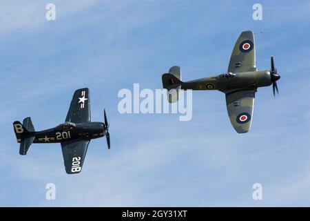 US Navy Grumman F8F Bearcat Vintage WW2 Fighter and Royal Navy Hawker Sea Fury at Flying Legends Duxford Airshow Stock Photo