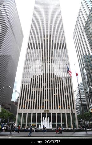 An American and Japanese flag fly outside of 1251 Avenue of the ...