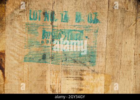 Texture detail of wine barrel with teal stamp Stock Photo