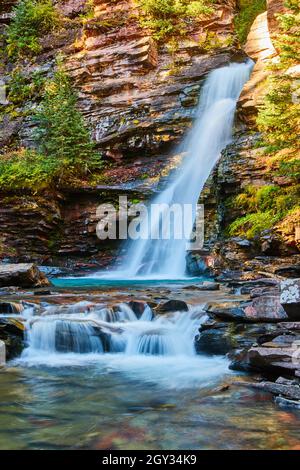 Beautiful waterfall in canyon with peaceful tranquil vibes Stock Photo