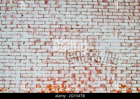 Texture of full wall of brick straight on of white and red with arch Stock Photo