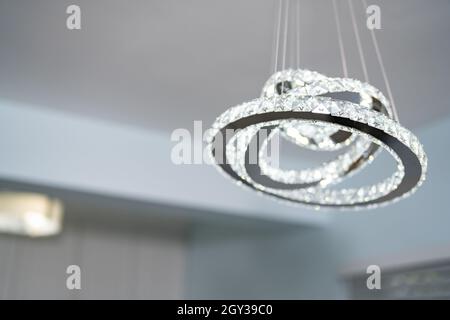 Abstract crystal chandelier hanging in a home Stock Photo