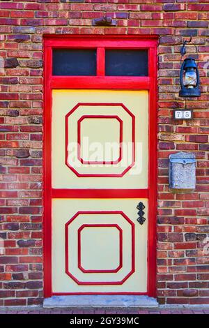 Colorful red door on red brick Stock Photo