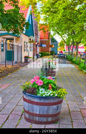 Rustic shopping area dutch style with beautiful flowerpots Stock Photo