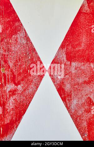 Wood plank painted dutch diagonal pattern of red and white Stock Photo