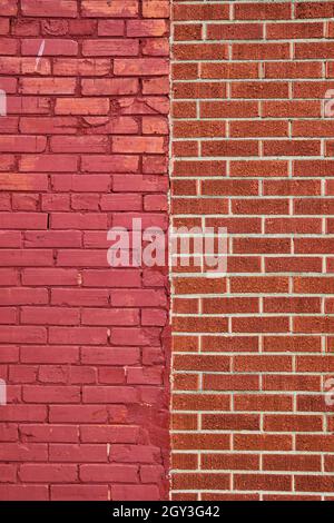 Vertical brick wall divided by two types of brick Stock Photo