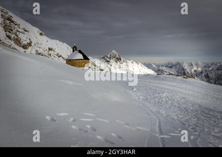 The Chapel of Mary, sits on the Zugspitze surrounded by snow in the Bavarian Alps near Garmisch-Partenkirchen, Germany.