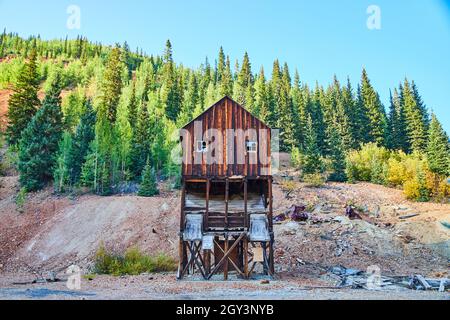 Old mining log structure in mountains now abandoned Stock Photo