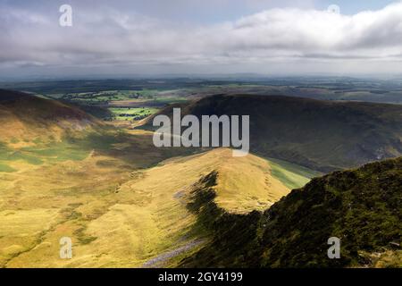 The View East From the Summit of Bannerdale Crags Over the East Ridge Towards the Pennines, Lake District, Cumbria, UK Stock Photo