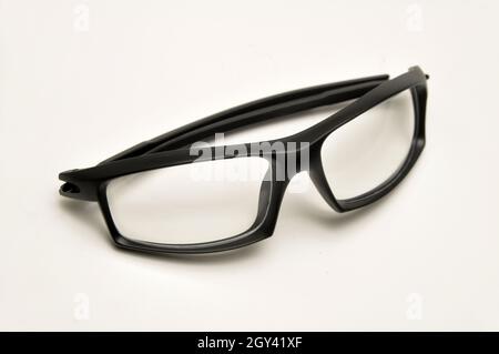 Reading glasses with black frames on a white background Stock Photo