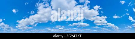 Wide panorama of bright blue sky with clouds Stock Photo