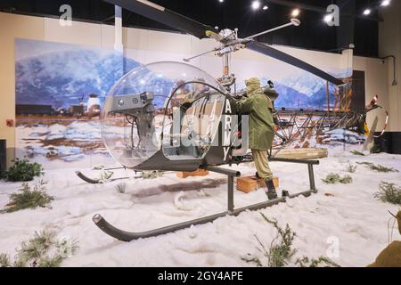 A Bell H-13E Sioux helicopter during a snowy winter in the Korean war. The same copter from the MASH TV show. At the US Army Transportation Museum at Stock Photo