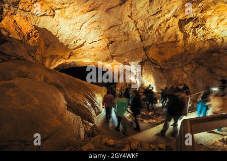 Tourists at the König-Artus-Dom inside the Dachstein Rieseneishöhle, a giant ice cave in the Austrian Alps, Salzkammergut Region Stock Photo