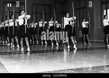 Italian Girls Perform A Choreography Together They Dance With The Bow In A Hall The Girls Belong To The Giovani Italiane Within The Fascist Youth Organization Opera Nazionale Balilla The Recording Was